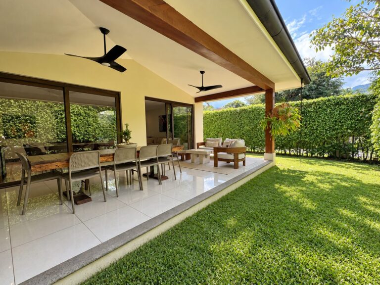 Modern Patio Overlooking a Lush Green Lawn